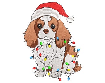 May include: An embroidered Cavalier King Charles Spaniel wearing a red Santa hat and wrapped in a string of colorful Christmas lights. The dog has brown and white fur and a sweet expression, perfect for holiday decor.