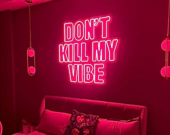 May include: A pink bedroom with a bed and a neon sign that says "Don't Kill My Vibe".