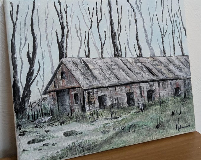 The product is an acrylic painting on canvas of a barn in a winter setting