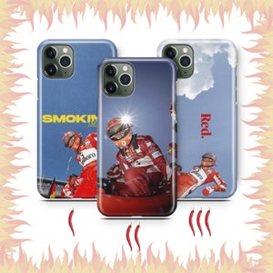 May include: Three phone cases with different designs. The first case is blue with the text "SMOKIN' & DRIFTIN'" and a photo of a racing driver. The second case is red with a photo of a racing driver. The third case is blue with the text "Red." and a photo of a racing driver.