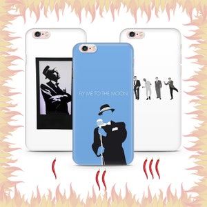 May include: Three different iPhone cases with a blue, white, and black color scheme. The blue case features a silhouette of a man singing with the text "Fly Me to the Moon". The white case features a silhouette of a group of men in a line. The black case features a silhouette of a man in a suit.
