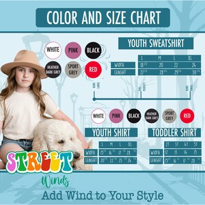 a girl in a hat holding a white dog