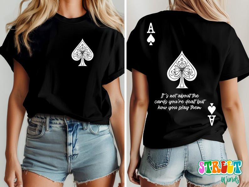 May include: Black t-shirt with a white ace of spades graphic and the text "It's not about the cards you're dealt but how you play them".