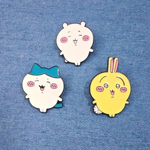 Super Cute and Adorable Japanese Chiikawa, Hachiware, and Usagi Enamel Pin Set. Perfect For adding charm to bags, backpacks, hats