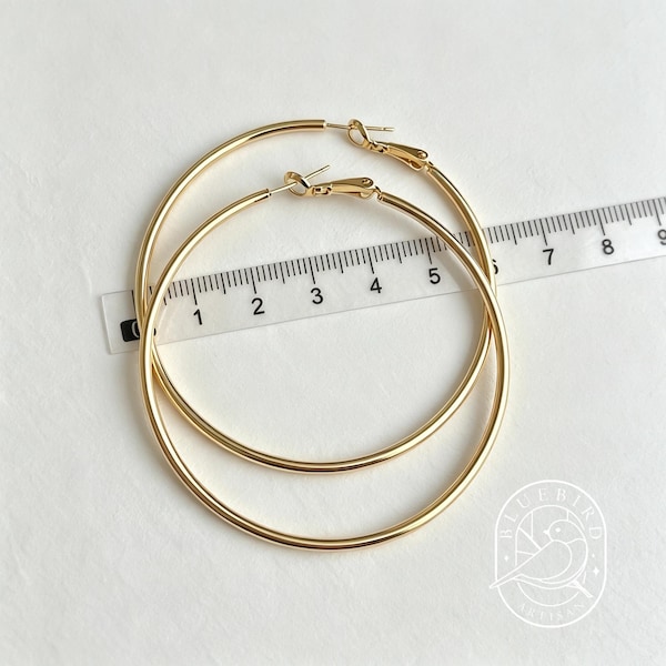 Classic gold tube hoop earrings in multiple sizes for minimalist everyday staple style