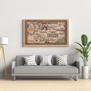 May include: A framed map with a detailed, vintage aesthetic. The map features intricate illustrations, text, and a decorative border. The artwork is displayed above a gray sofa with patterned pillows, complemented by a floor lamp and potted plants.