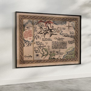 May include: Framed fantasy map with intricate illustrations and text, depicting a fictional landscape with mountains, a dragon, and a serpent. The map is in shades of brown, beige, and green, with a black frame. The map is hanging on a white wall.