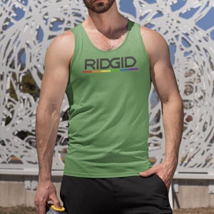 May include: Green tank top with the word "RIDGID" in gray letters and a rainbow stripe underneath. The person is wearing black sweatpants and holding a clear water bottle with a yellow lid.