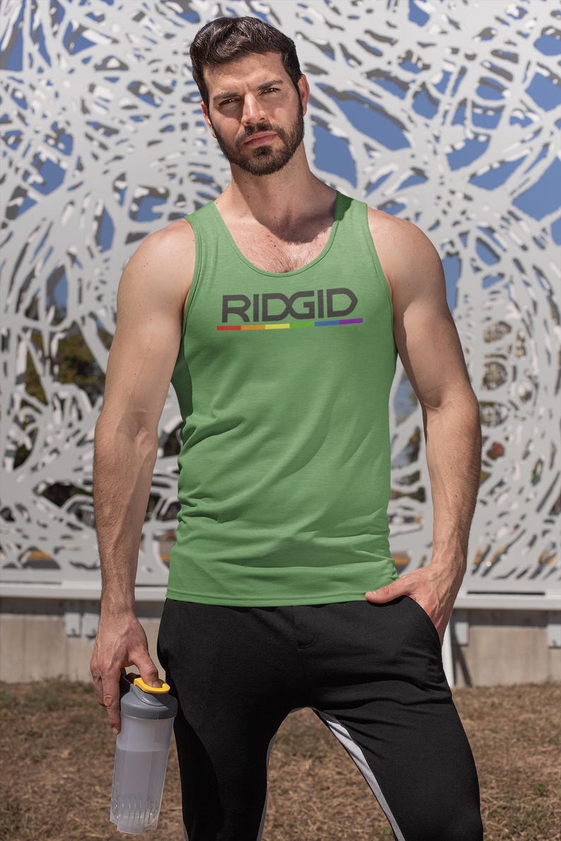 May include: Green tank top with the word "RIDGID" in gray letters and a rainbow stripe underneath. The person is wearing black sweatpants and holding a clear water bottle with a yellow lid.