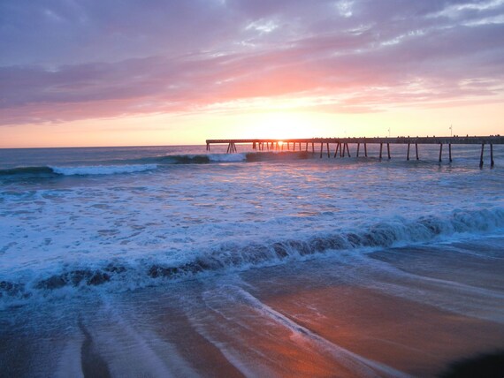 Sunset Through the Pier: As the sun slowly descended, the sky was painted with vibrant hues casting a warm glow over the pier.