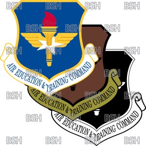 May include: A blue shield with a white star and a torch, surrounded by a gold ribbon with the text "Air Education & Training Command".
