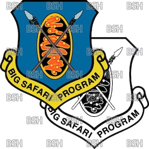 May include: A blue and white shield with a yellow and orange design in the center. The shield is surrounded by a black ribbon with the text "BIG SAFARI PROGRAM" on it.