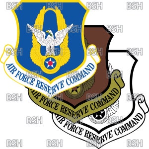 May include: A blue, white, and gold Air Force Reserve Command emblem with a stylized eagle and a star. The emblem is surrounded by a white banner with the words "Air Force Reserve Command" in black.