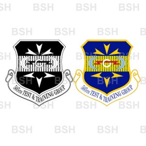 May include: Two shield-shaped emblems of the 505th Test & Training Group. One is black and white, the other is blue, yellow, and red. Both feature a central lightning bolt, two crescent moons, and arrows pointing up and down with text below.