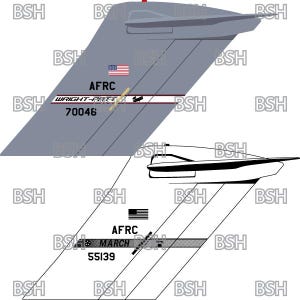 May include: A gray and white airplane tail with the text "AFRC" and "WRIGHT-PATTERSON" in black lettering. The tail number "70046" is also visible in black lettering. The airplane has a red, white, and blue American flag on the tail.