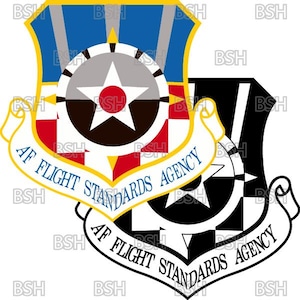 May include: Two AF Flight Standards Agency emblems are shown. The top emblem is in colour, with blue, yellow, red, and white elements. The bottom emblem is a black and white version of the same design. The text "AF FLIGHT STANDARDS AGENCY" is on a banner.