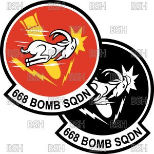 May include: Two circular patches featuring a white ram with a yellow explosion and lightning bolts. One patch is red with black trim, the other is black with white trim. Both patches have the text "668 BOMB SQDN".