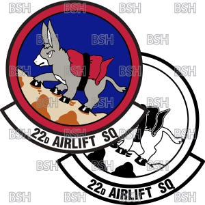 May include: A red, white, and blue circular patch with a cartoon donkey carrying a red and black pack on its back. The donkey is walking up a brown hill. The text "22d AIRLIFT SQ" is written in a white arc below the donkey.
