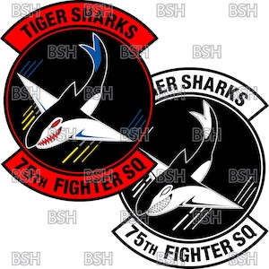 以下が含まれることがあります： サメのデザインが施された白黒のエンブレム。エンブレムには、「Tiger Sharks」と「75th Fighter Sq」という赤と白の文字が書かれています。