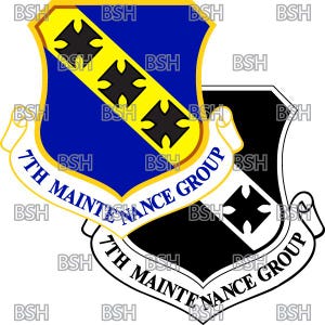 May include: A black and white shield with a yellow stripe and three black crosses. The shield is surrounded by a white scroll with the text "7th Maintenance Group".