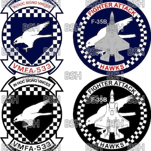 May include: Four military-themed patches. Two feature a stylized eagle and the text "VMFA-533" with the motto "IN HOC SIGNO VINCES". The other two patches display a fighter jet with the text "FIGHTER ATTACK" and "HAWKS".