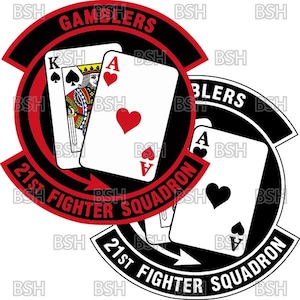 May include: Two patches featuring playing cards and text. One patch has a red and black design with the words "GAMBLERS" and "21st FIGHTER SQUADRON." The other patch is black and white with an ace of spades and the same squadron text.