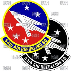 May include: A yellow, red, blue, and black circular patch with a white stylized bird and five white stars. The text "54th AIR REFUELING SQ" is written in a yellow arc around the outside of the patch.