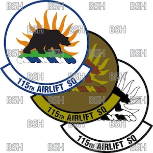 May include: A white, brown, and black patch with a black bear walking on a green hill. The bear is walking towards a yellow sun with orange rays. The patch has a blue rope with white stripes around the hill. The text "115th AIRLIFT SQ" is written in a white arc around the bottom of the patch.
