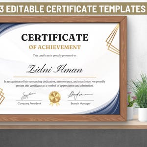 May include: A blue and gold certificate of achievement with a white background. The certificate is framed in a wooden frame. The text on the certificate reads "Certificate of Achievement" and "This certificate is proudly presented to: Lidni Ilman".