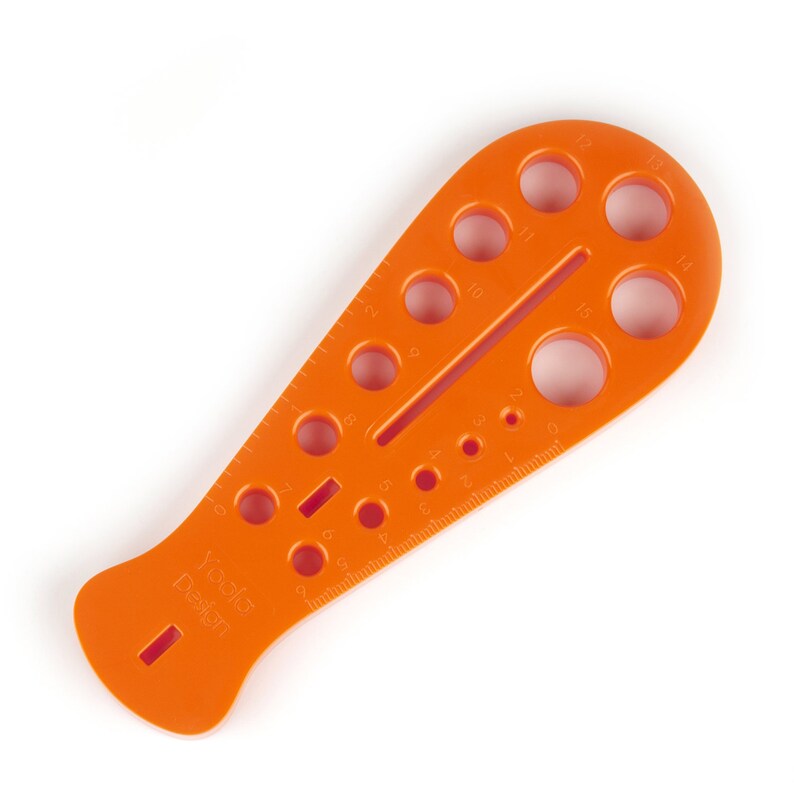 May include: Orange plastic knitting needle gauge with a ruler on one side and a series of holes for different needle sizes on the other side. The gauge is labeled "Yada Design".