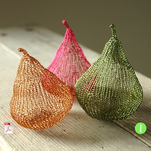 May include: Three crocheted pear-shaped ornaments in pink, green, and gold. The ornaments are made of wire and have a delicate, lacy texture.