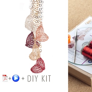 May include: DIY kit for making a necklace with multiple heart-shaped pendants. The kit includes red, gold, and silver wire, a crochet hook, and instructions.  The finished necklace is shown in the image.