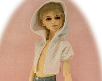 May include: A doll wearing a white hooded sweater and blue denim shorts. The doll is holding a pair of blue and white sneakers.