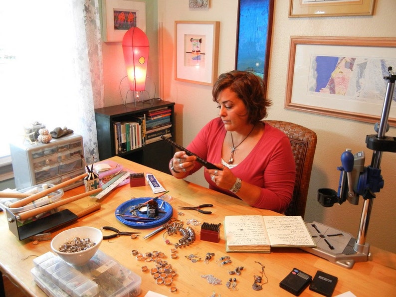 Licky Drake, an Etsy artist, created sterling silver jewelry in her Kentucky studio.