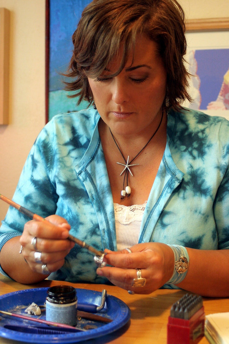Top selling Etsy artist Licky Drake creating sterling silver jewelry in her Kentucky studio.