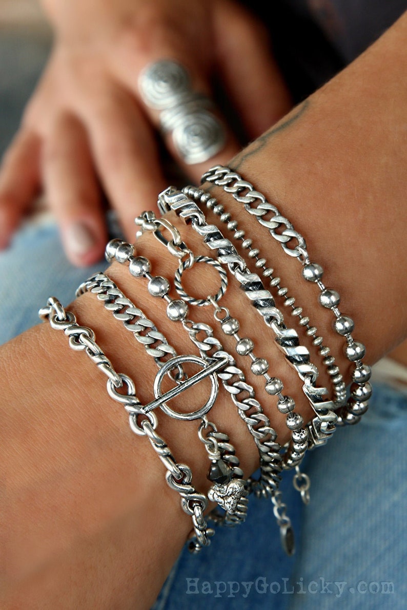 Sterling silver stacking cuffs and layering chain bracelets offer a cool boho chic look. Ideal for an instant collection, or choose any design to add new intrigue to your own personal favorites.