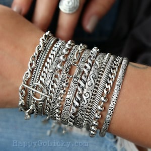 Sterling silver stacking cuffs and layering chain bracelets offer a cool boho chic look. Ideal for an instant collection, or choose any design to add new intrigue to your own personal favorites.