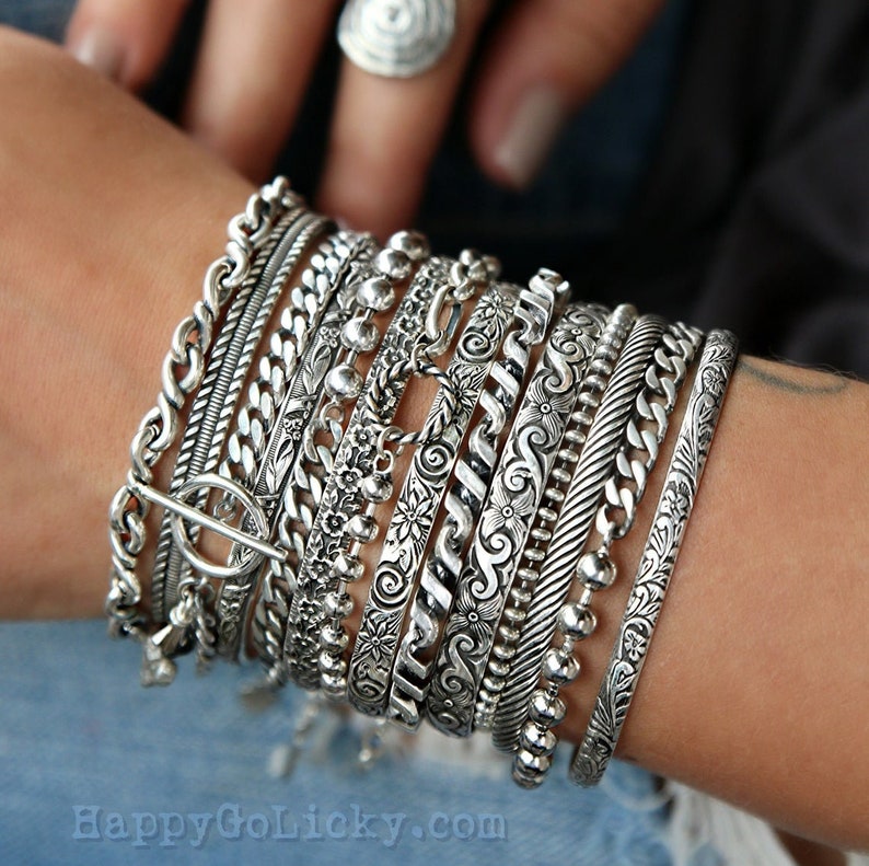 Sterling silver stacking cuffs and layering chain bracelets offer a cool boho chic look. Ideal for an instant collection, or choose any design to add new intrigue to your own personal favorites.