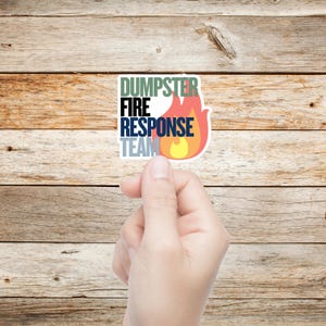 May include: A white sticker with the words 'DUMPSER FIRE RESPONSE TEAM' in different colors. The word 'FIRE' is in black, 'DUMPSER' is in green, 'RESPONSE' is in blue, and 'TEAM' is in gray. A red and yellow flame graphic is next to the words.

Dumpster Fire Vinyl Sticker, Funny office gift for coworker, Dumpster Fire Response Team, vinyl waterproof sticker, office gag gift for boss