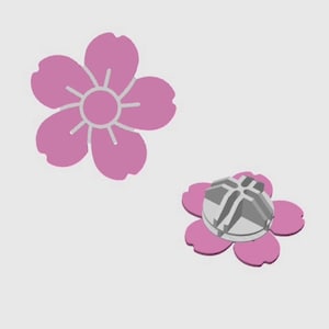 Puede incluir: Dos diseños de flores de cerezo rosas. Uno es una ilustración plana con detalles en blanco. El otro es un diseño 3D con un centro geométrico gris. Las flores están sobre un fondo blanco liso.