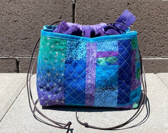 Purple Weebrawbag drawstring bag with patchwork pockets aqua and green and purple