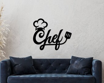 May include: Black metal wall decor with the word "Chef" in a stylized font, a chef's hat, and a spatula.