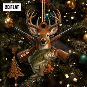 May include: A 2D flat Christmas ornament featuring a deer head with antlers, crossed rifles, and a fish. The ornament has the name "Jackson" on it. The background is a decorated Christmas tree with lights and ornaments.