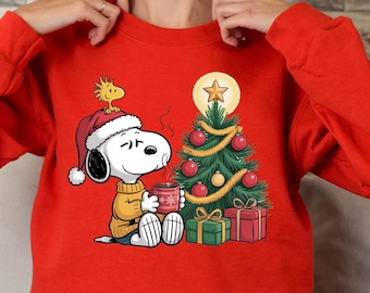Snoopy Christmas Sweatshirt, Peanuts Holiday Sweater, Cute Santa Hat Pullover, Cozy Winter Gift, Festive Xmas Outfit Charlie Brown tee