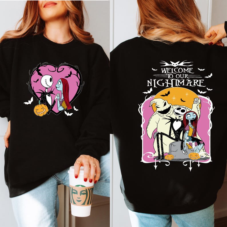 May include: Black sweatshirt featuring a heart-shaped design with Jack Skellington and Sally. The front design includes a pumpkin. The back of the sweatshirt has the text "WELCOME TO OUR NIGHTMARE" with characters from The Nightmare Before Christmas.