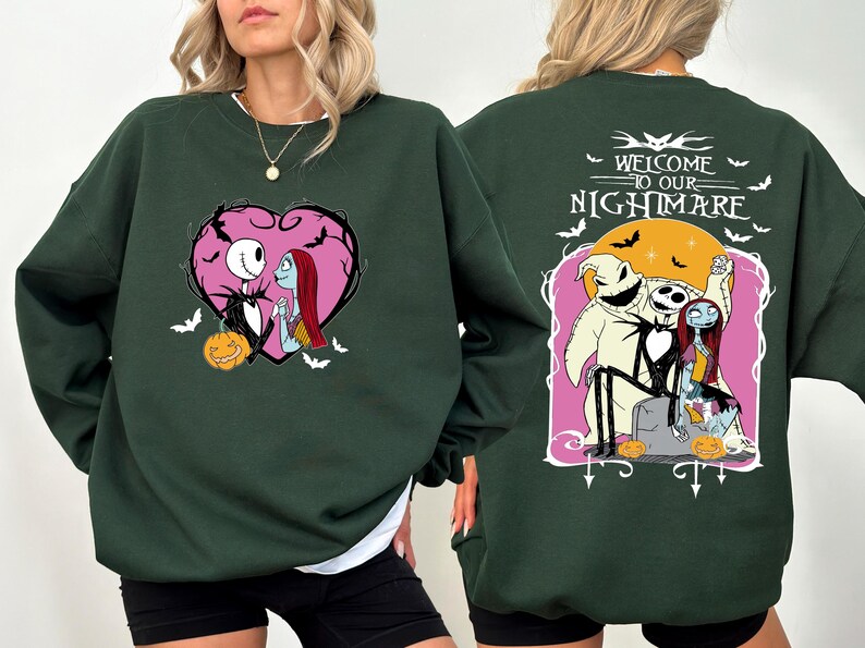 May include: Dark green sweatshirt featuring a heart-shaped graphic with Jack Skellington and Sally. The back of the sweatshirt has the text "Welcome to our Nightmare" with Jack, Sally, and Oogie Boogie. Includes bats and pumpkins.