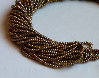 One hank of Czech Silk Bronze Aurora Borealis Finish seed beads - 1014 size 11