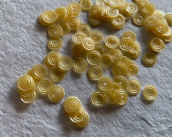 7g of 8 mm Swirl Round Sequins in Matte Yellow Color