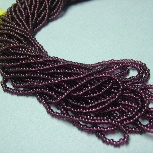 One hank of Czech Transparent Deep Amethyst seed beads 0704 size 11 image 2