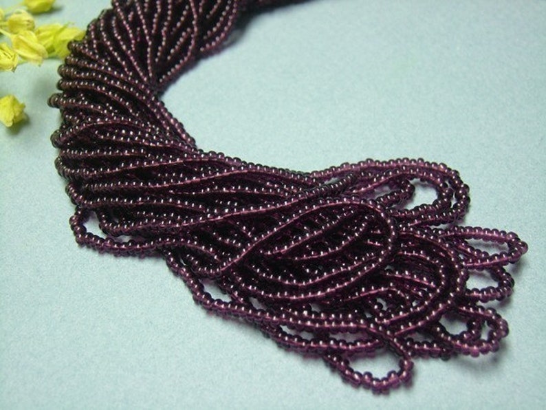 One hank of Czech Transparent Deep Amethyst seed beads 0704 size 11 image 2